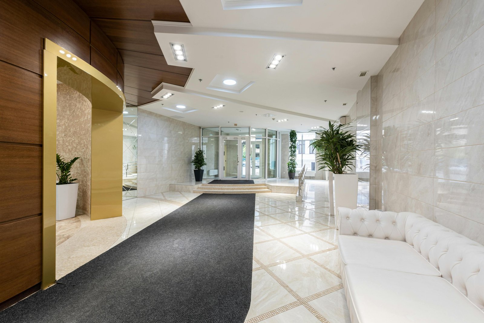 Bright lobby corridor with polished marble floors